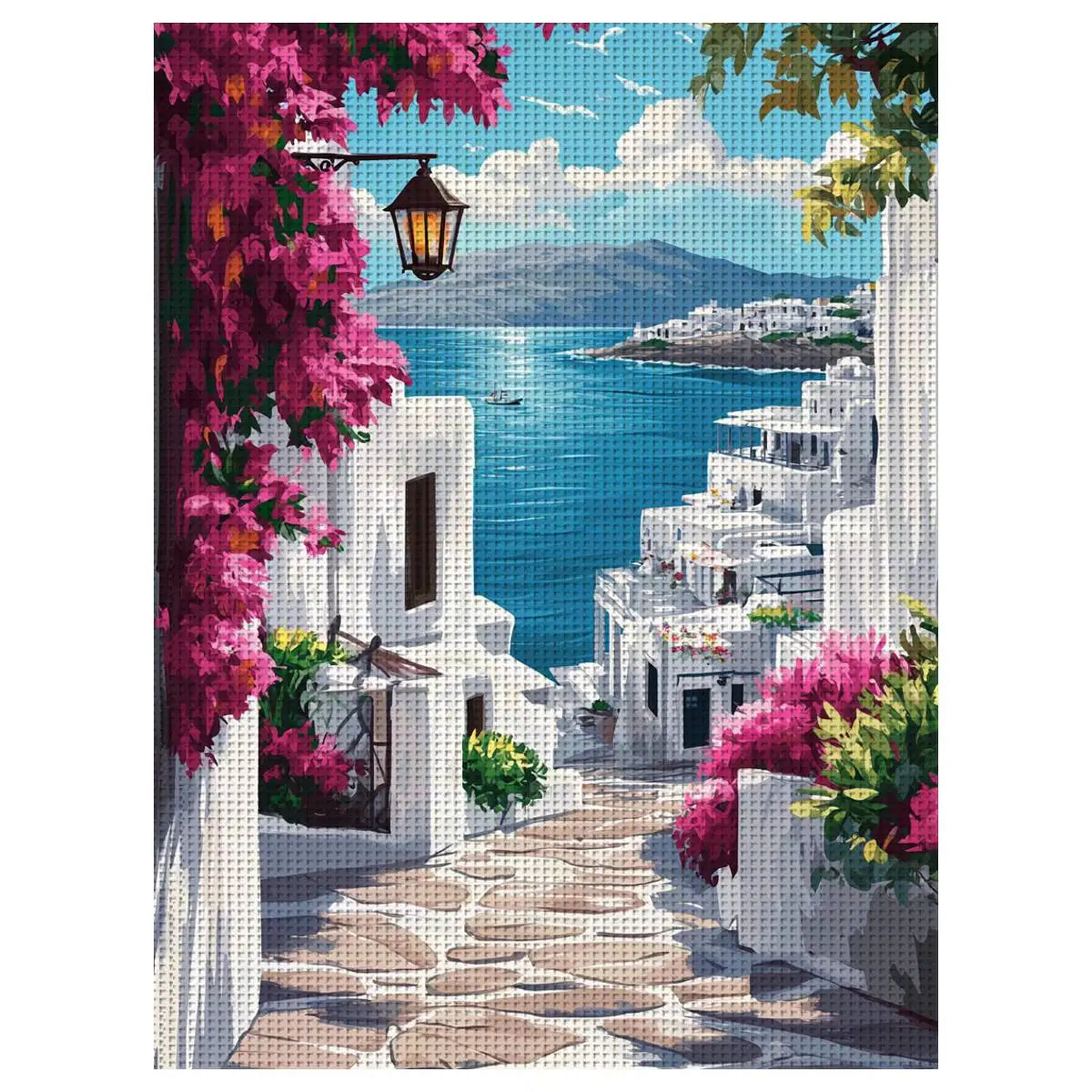 Toile point de croix imprimee representant une ruelle de Santorin avec ses maisons blanches ses bougainvilliers roses et la mer azur.