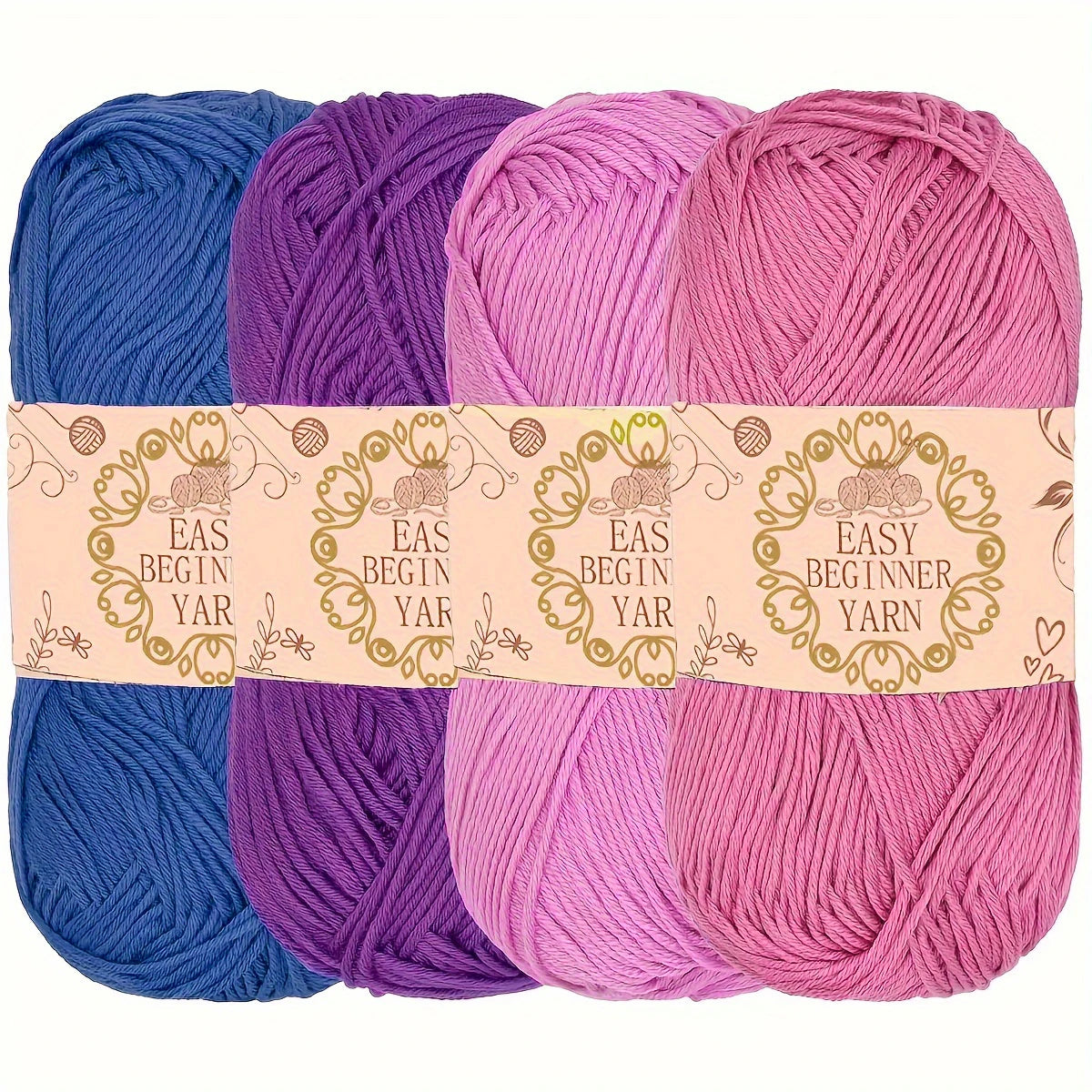 Lot de quatre pelotes de laine pour débutant dégradées dans les tons de violet et rose fuchsia