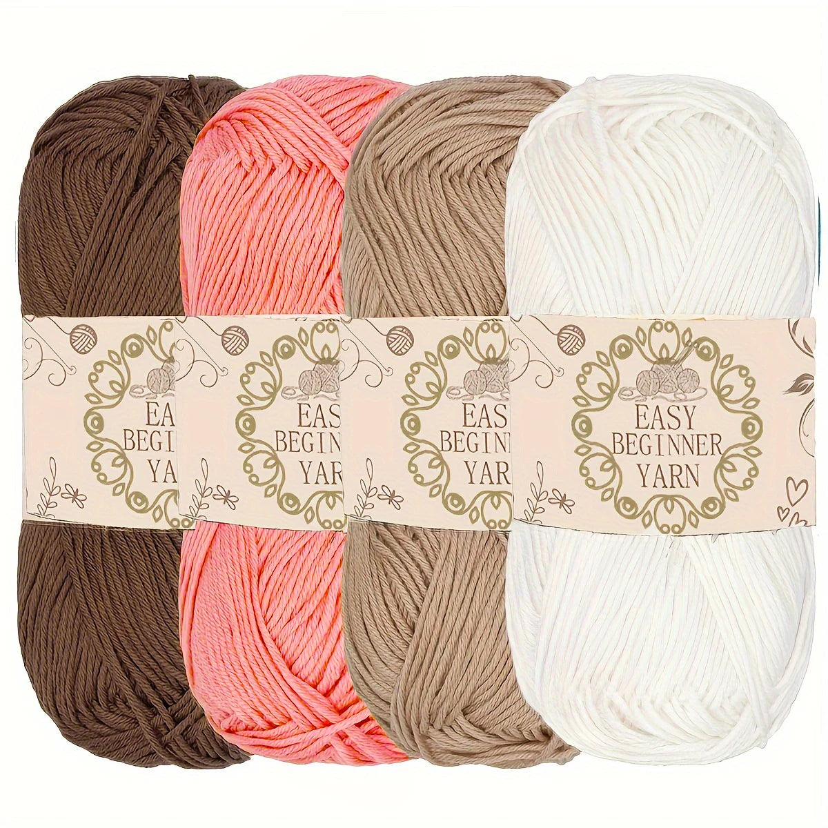 Quatre pelotes de laine de couleurs douces marron vieux rose beige et blanc crème pour le crochet
