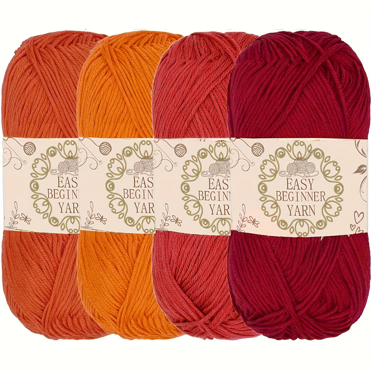 Lot de quatre pelotes de laine pour débutant de couleurs chaudes orange rouge et bordeaux foncé