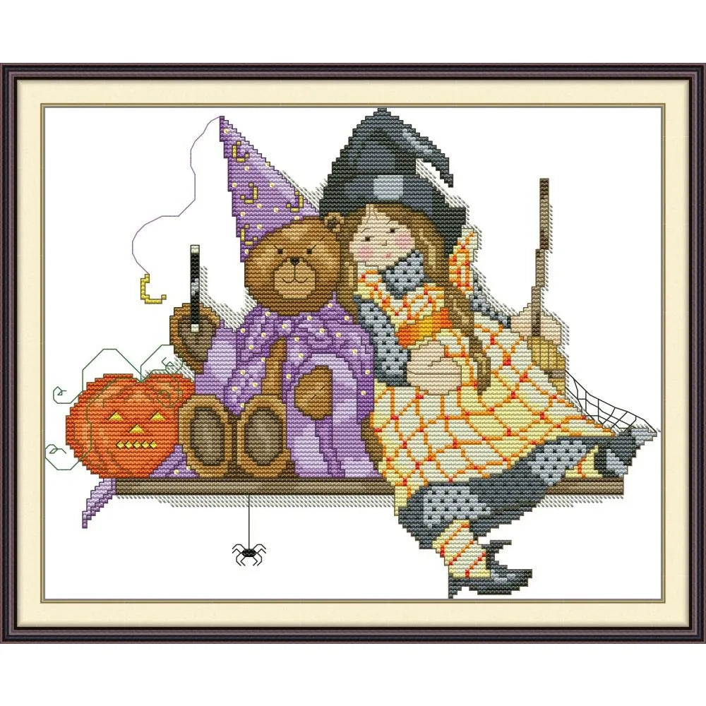 Diagramme de point de croix motif Halloween retro avec une petite sorciere et un ours en peluche assis sur un banc a cote d'une citrouille.
